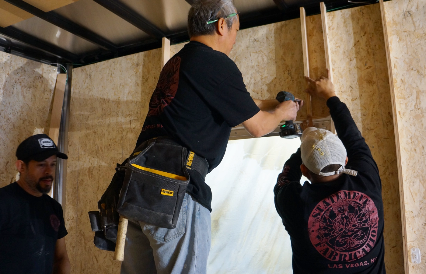 Carpenters customizing a trailer