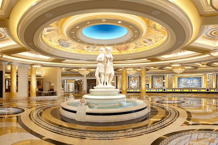 Caesars Palace luxury resort lobby with fountain and sculpted figures, showcasing scenic architectural fabrication.