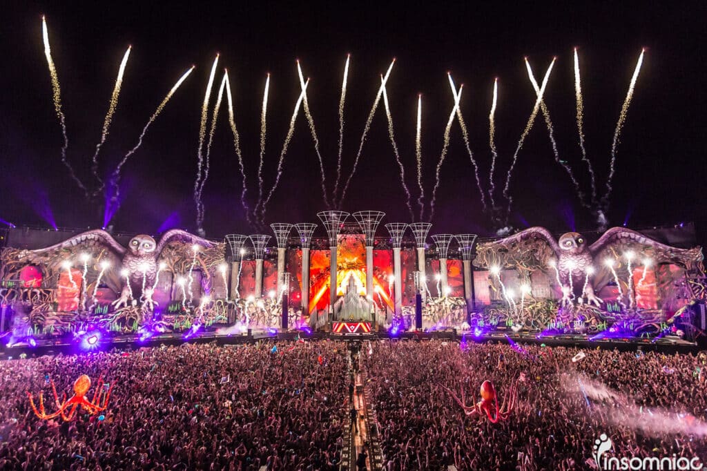 Festival stage with fireworks and custom scenic fabrication for immersive events.