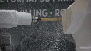CNC foam carving process creating detailed three-dimensional shapes from foam blocks.