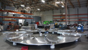 Scenic fabricator at work in Las Vegas fabrication shop, creating event structures.