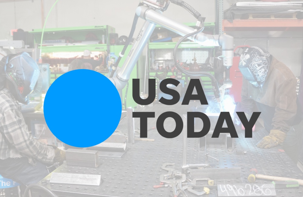 Robotic arm and welders in fabrication shop, featured in USA Today.