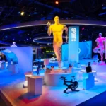 Custom-fabricated trade show exhibit with branded structures and interactive display features.